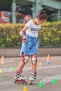 Girl practicing inline skating, Beijing, China